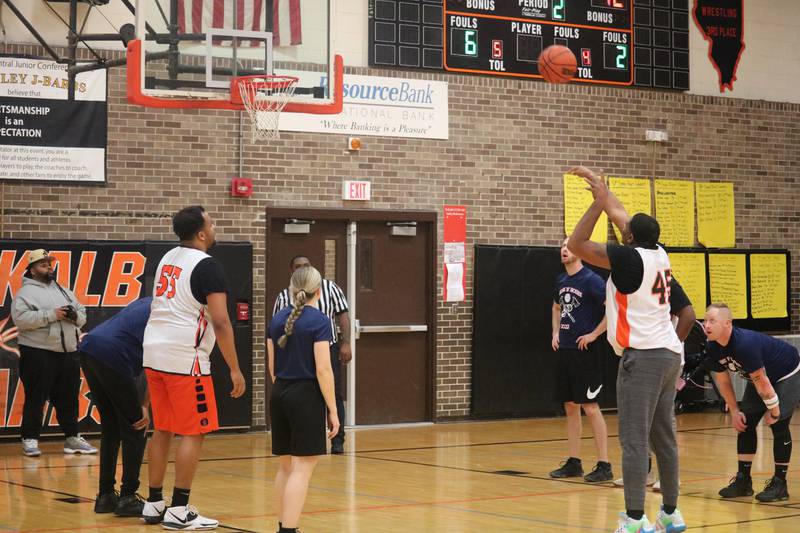 Darnell Coleman shoots a bucket at the free-throw line Dec. 4, 2023 during the annual Guns and Hoses Basketball Game put on at Huntley Middle School in DeKalb.
