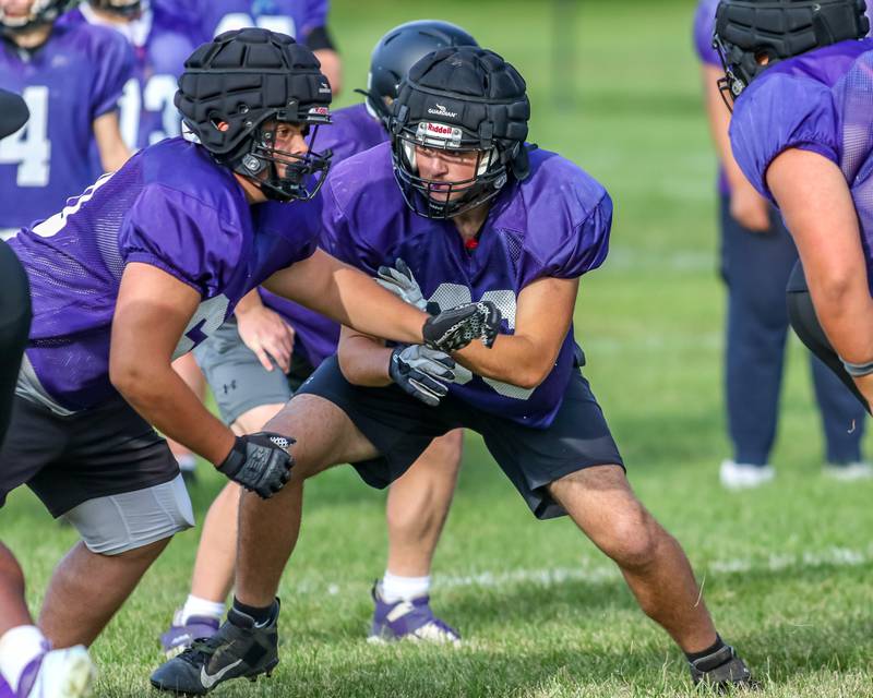 Rider Larson (C) pulls on running play at Plano High School football practice. Aug 20 2024.