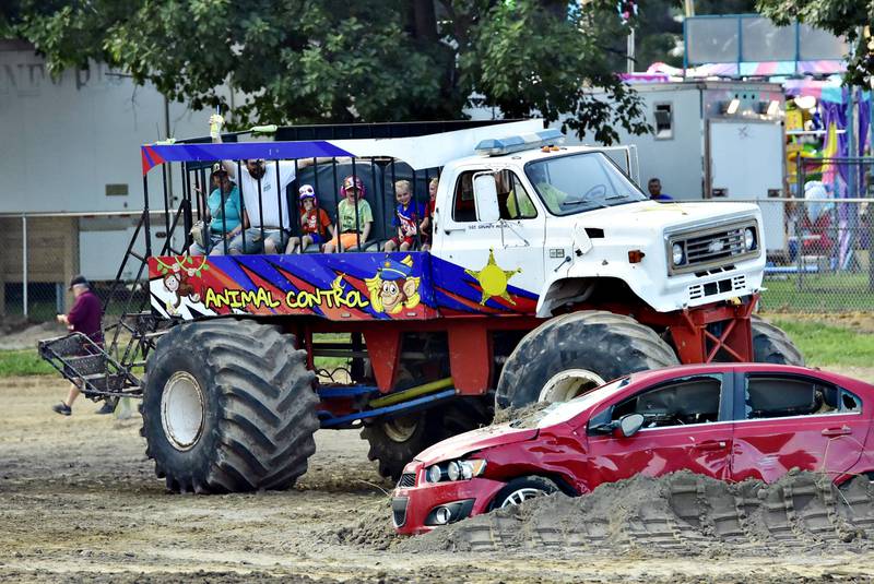 Kids and adults alike climbed board “Animal Control” on Thursday, Aug. 14, 2025, at the Whiteside County Fair for a monster truck ride. Although Dean Shorter, the driver of the mobile machine, didn't go over the wrecked cars, he did do a few donuts around the track to thrill the riders.