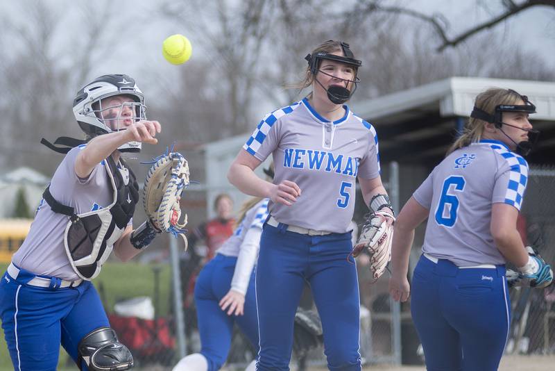 Newman's Carlin Brady throws to first on a bunt against Hall Tuesday, April 19, 2022.