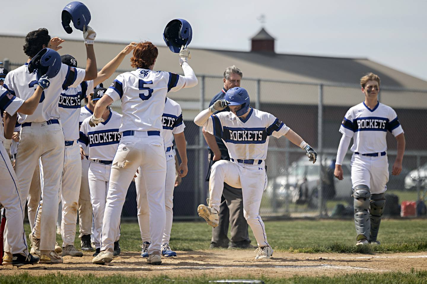 Burlington Central’s Brady Gilroy stomps on home plate to seal the deal for a four inning 15-0 win over Sterling during a class 3A regional final in Rochelle Saturday, May 27, 2023.