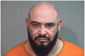 Convicted killer charged with domestic violence, shooting gun outside Marengo restaurant in custody