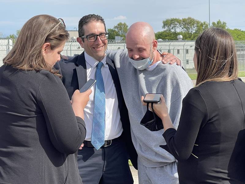 Kenneth Smith, 45, puts his arm around attorney David Jimenez-Ekman after walking out of Lawrence Correctional Center in Sumner on Thursday, May 6, 2021. Smith was greeted by members of the law firm Jenner and Block of Chicago, who helped secure his release after serving nearly 20 years for the 2001 murder of Raul Briseno.