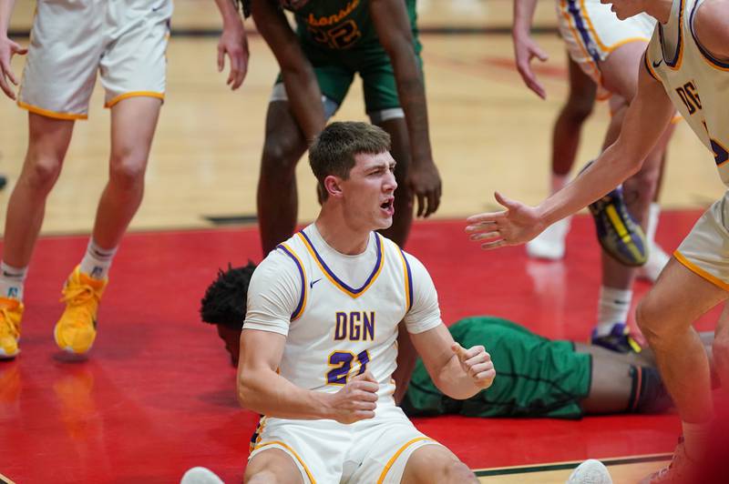 Downers Grove North's Jack Stanton (21) reacts after making defensive stop during a Class 4A East Aurora sectional semifinal basketball game against Waubonsie Valley at East Aurora High School on Wednesday, Feb 28, 2024.