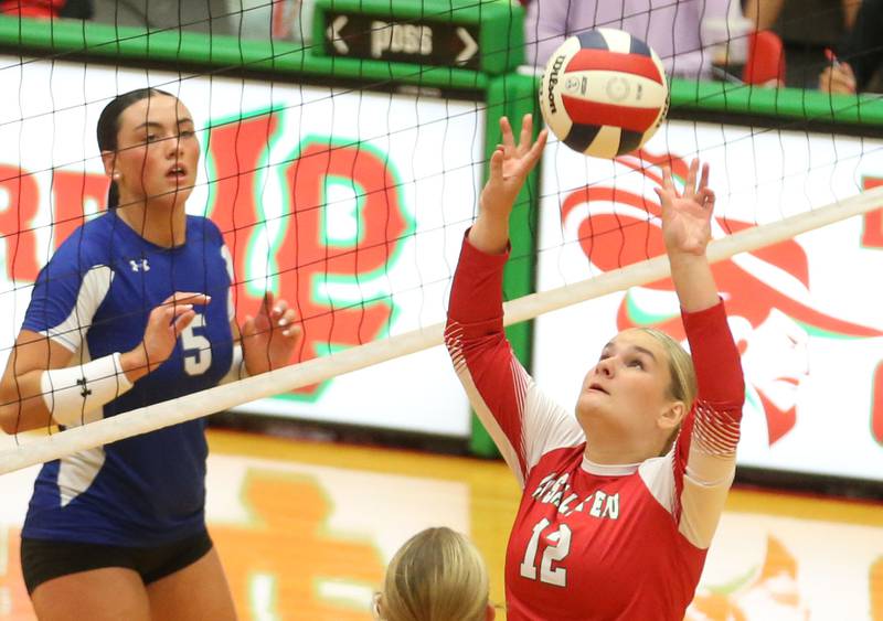 L-P's Emma Jereb sets the ball in the air as Princeton's Keely Lawson eyes the play on Tuesday, Aug. 26, 2025 in AJ Sellett Gymnasium at L-P High School.