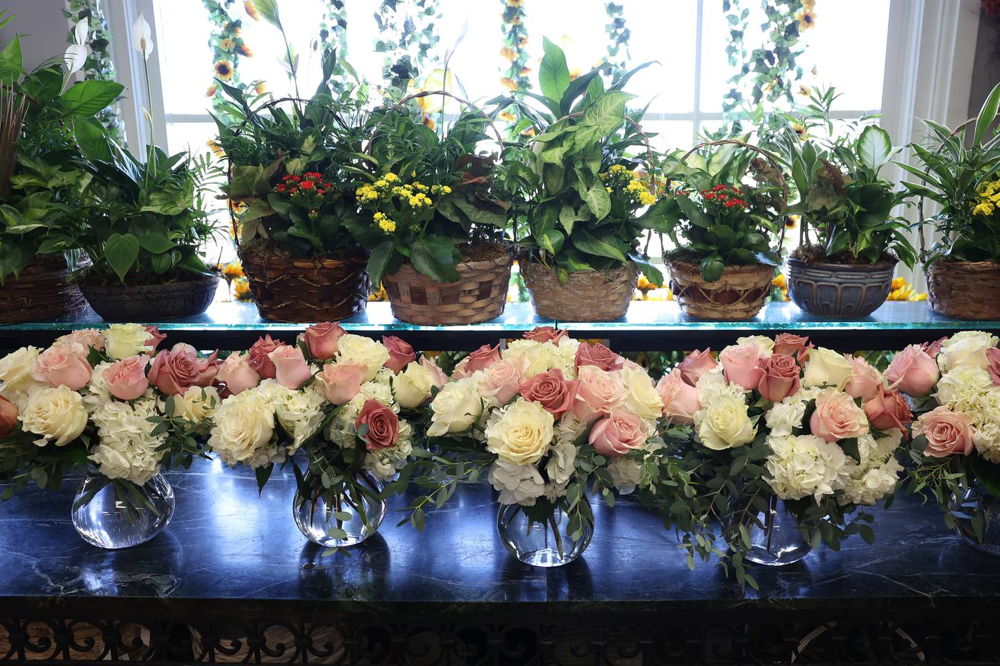 Fresh cut flower arrangements sit in the lobby of Palmer House Florist on Friday, Sept. 29, 2023 in Joliet.