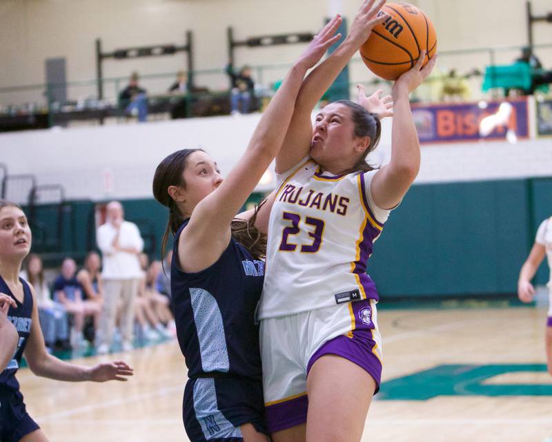 Downers Grove North's Gianna Goodwin drives in for the layup against Nazareth during the Dave Yates Chicagoland Showcase on Saturday, Dec7,2024 at Fremd in Palatine.