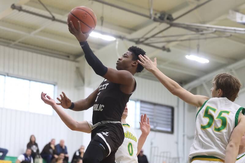 Joliet Catholic’s Jayden Armstrong lays in a shot against Providence on Saturday, Dec. 9th, 2023 in New Lenox.