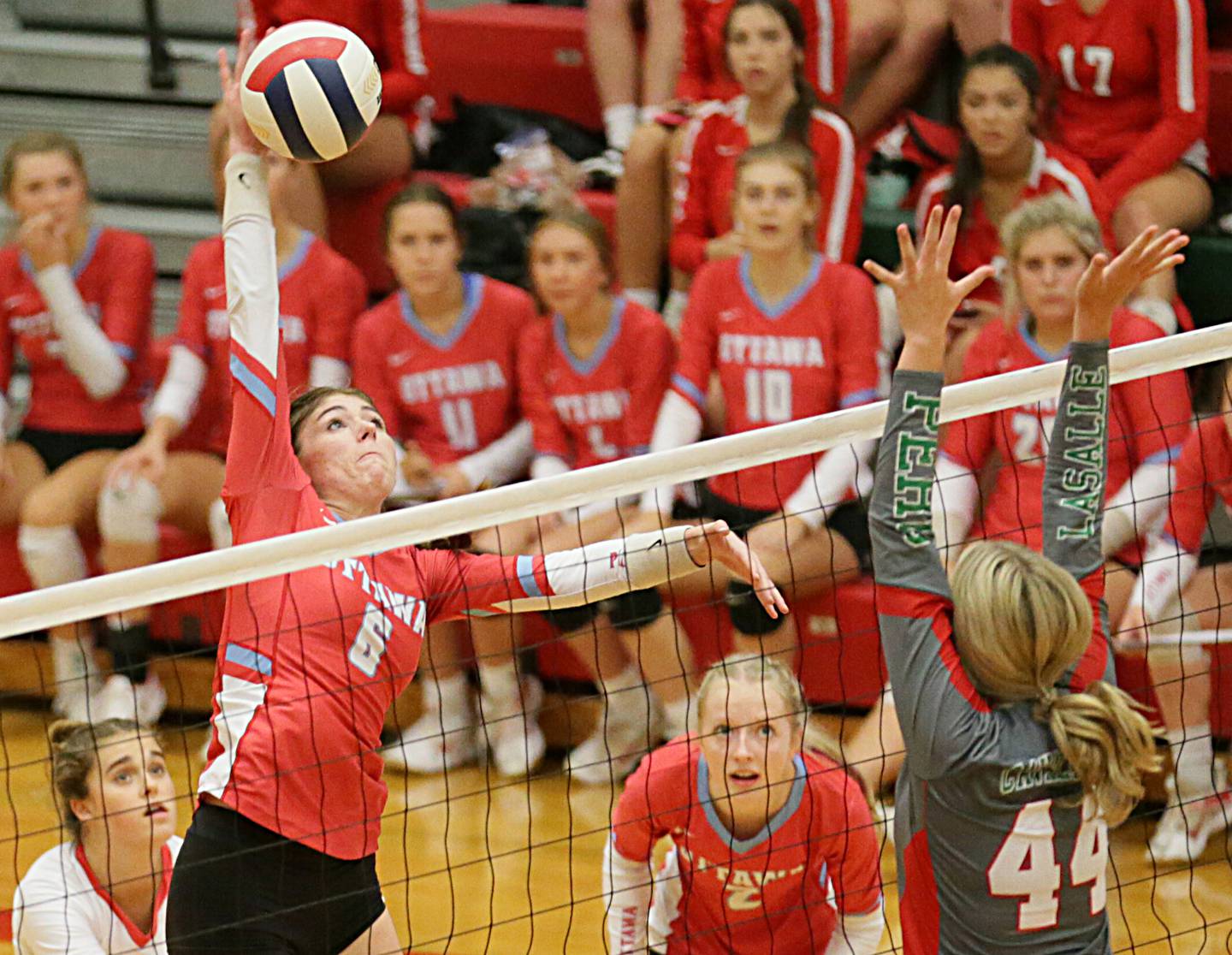 Ottawa's Mel Pries (6) sends a kill past La Salle-Peru's Camryn Piscia (44) on Thursday Sept. 22, at A.J. Sellett Gymnasium.