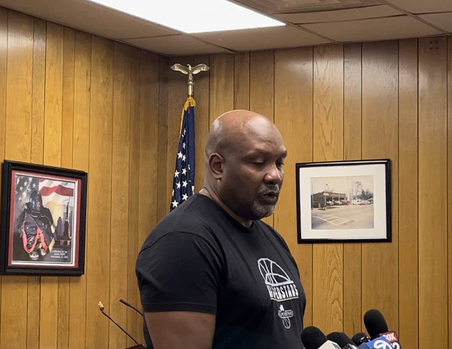 Chenier Alston, senior pastor of New Israelite Baptist Church, speaks at a news conference on Tuesday, July 9, in Rockdale.