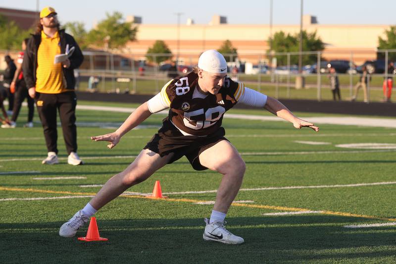 Joliet Catholic’s Jack Lynch does a cone drill at the IHSA Southwest Suburb Showcase combine on Thursday, May 7, 2026 at Plainfield North High School.