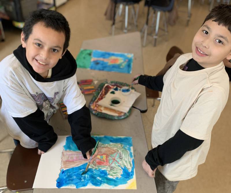 Plano students Jiovanni Aguilar, left, and Liam Avalos work on artwork that will be viewed at the April 13 art show.