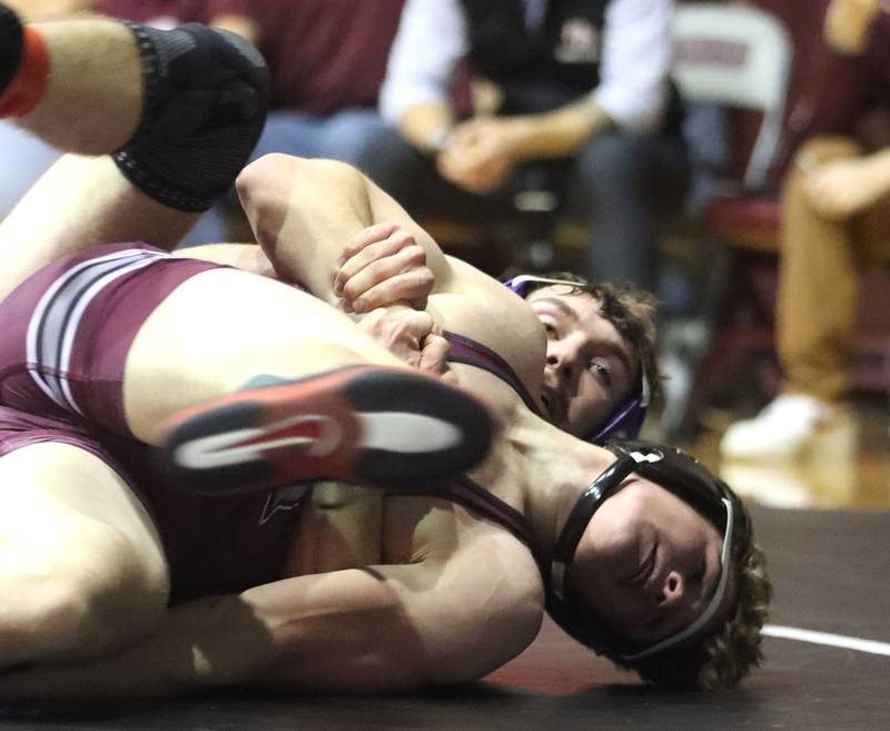 Prairie Ridge’s Matt Moritz, front, battles Hampshire’s Mike Brannigan at 157 pounds in varsity boys wrestling on Thursday, Dec. 4, 2025, at  Prairie Ridge High School in Crystal Lake.