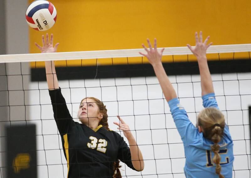 Putnam County's Maggie Spratt gets the ball past Marquette's Lilly Craig on Thursday, Sept 7, 2023 at Putnam County High School.