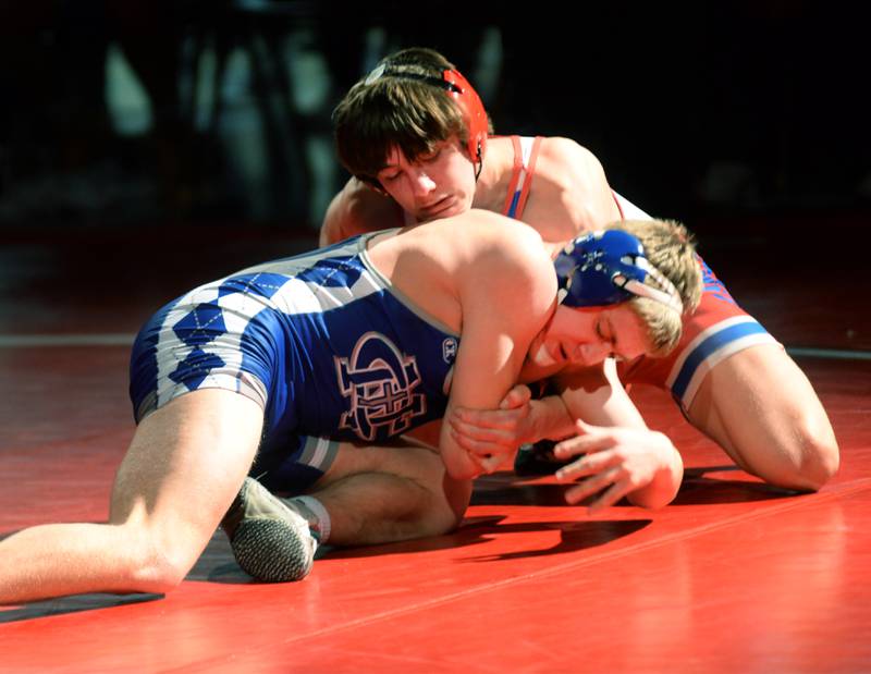 Oregon's Levi Benton holds Sterling Newman's Seamus McDonnell in the 144-pound match at the 1A team sectional held Tuesday, Feb. 25, 2025 in the Blackhawk Center in Oregon. The Hawks beat Newman 39-30 to advance to the state final this weekend.