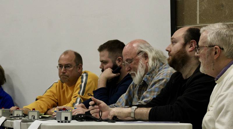 Stumped? Members of the Quad City Knowmads contemplate their answer during the Stupor Bowl trivia contest championship on Saturday, Feb. 11, 2023, at Reagan Middle School in Dixon.