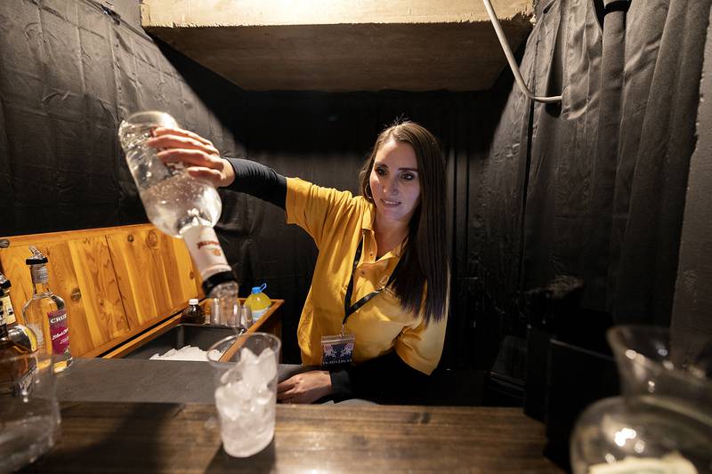 Danielle Velez pours a drink Sunday, March 2, 2025, at The Dixon. New cocktail bars and concession areas have been added to the theater.