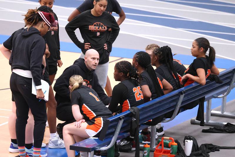 DeKalb girls basketball head coach Brad Bjelk talks to his team during their game against Belvidere North Friday, Nov. 17, 2023, in the Mark Einwich Varsity Girls Basketball Rockets Kickoff Tournament at Burlington Central High School.