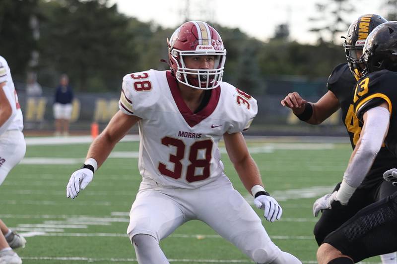 Morris’ Hayden Hutchcraft looks to make a play against Joliet West on Friday, Sept. 6, 2024 in Joliet.