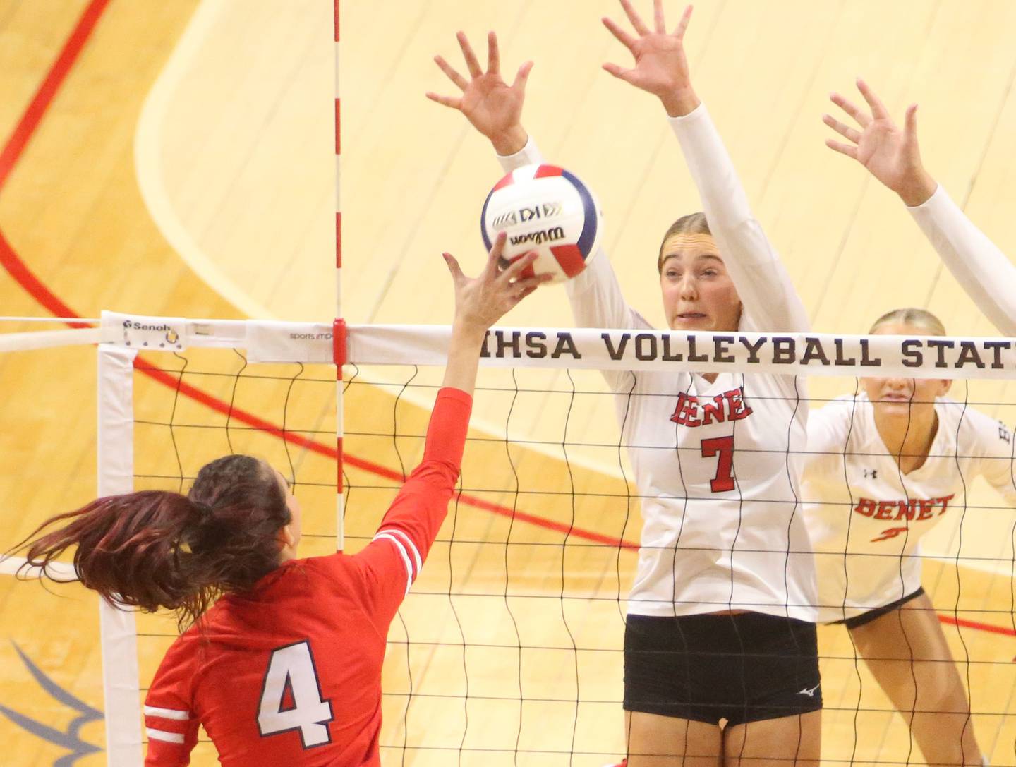 Huntley's Diellza Sejdini spike is blocked by Benet Academy's Audrey Asleson during the Class 4A State semifinal game on Friday, Nov. 15, 2024 at CEFCU Arena in Normal.
