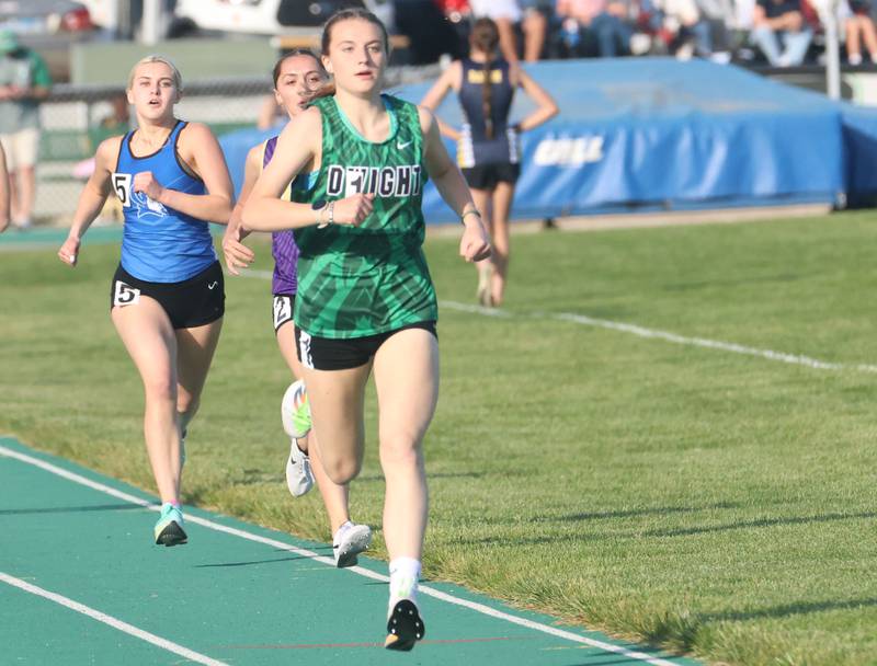 Dwight's Mikayla Chambers leads Serena's Finley Jobst and Peotone's Celeste Richards during the 800 meter run during the Class 1A Sectional meet on Thursday, May 14, 2026 at Seneca High School.