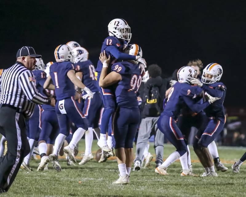 Oswego celebrates their win over Lockport after a missed last second field goal attempt to tie the game during Class 8A semifinal football game between Lockport at Oswego. Saturday, Nov 22, 2025 in Oswego.