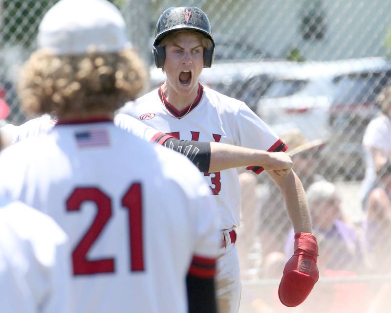 Hall's Max Bryant reacts after scoring a run during the Class 2A Sectional final game on Saturday, May 27, 2023 at Knoxville High School.