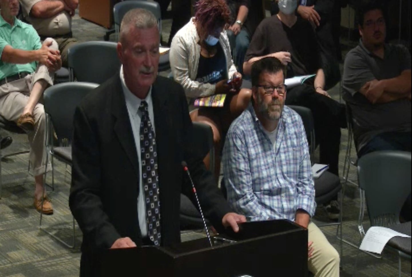 Dwayne Killian, retired Joliet police sergeant and former member of the Tri-County Auto Theft Task Force, speaks before the Joliet City Council on July 6, 2021.