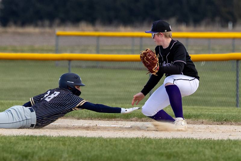 Thomas Giebel of Hiawatha slides back to first base after pitcher attempts to throw him out on Monday, April 7, 2025 at Serena High School in Serena.