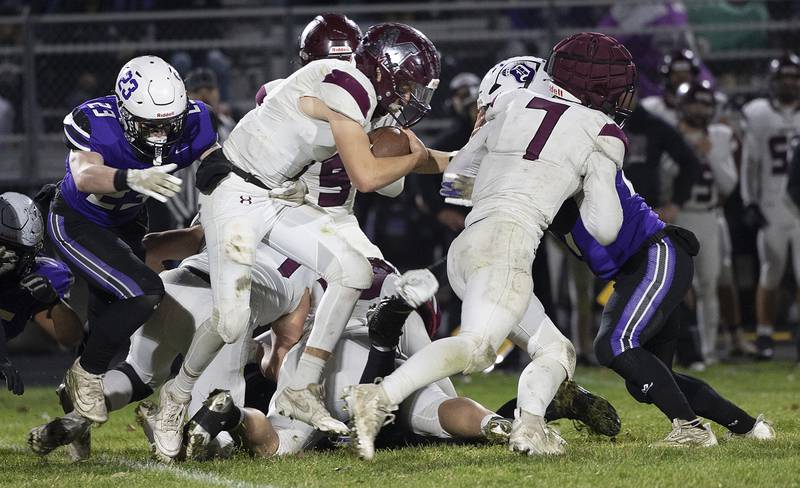 Marengo’s David Lopez picks up yards up the middle against Dixon Friday, Nov. 1, 2024 in the 4A football playoffs in Dixon.