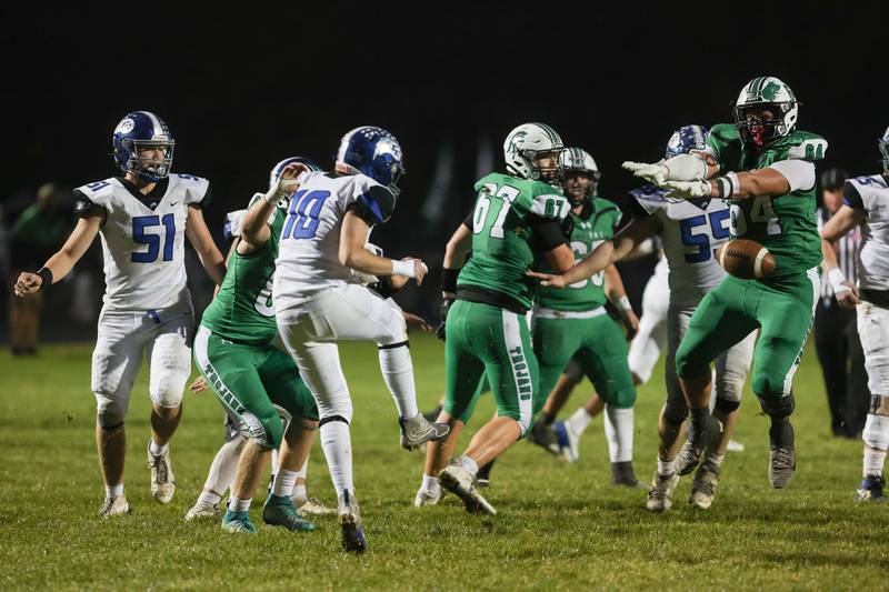 Dwight's Will Anderson, right, blocks a punt before returning it for a touchdown during Dwight's 43-14 victory over Clifton Central in second round playoffs on Saturday, Nov. 8, 2025.