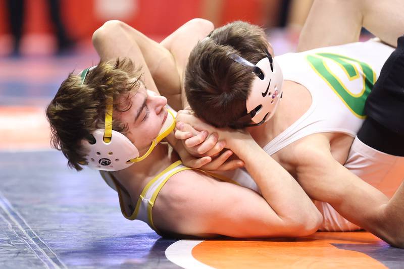 Crystal Lake South’s Josh Glover wraps up Geneseo’s Zachary Montez in the Class 2A 113lb. 3rd place match at State Farm Center in Champaign. Saturday, Feb. 19, 2022, in Champaign.