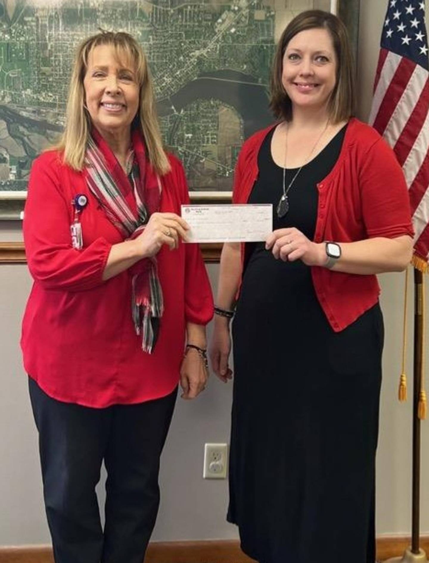 (Left to right); Joan Hermes $24,374.60 receives check from Angie Schneider