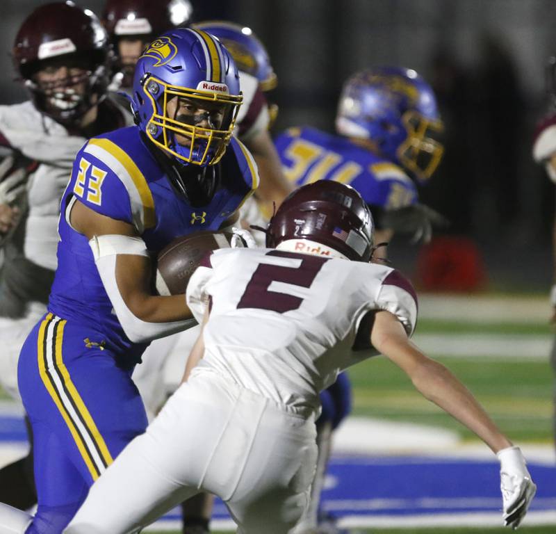 Johnsburg's Mario Zakrzewski avoids the tackle of Marengo's Cooper Lopez as he runs for a touchdown during a Kishwaukee River Conference football game on Friday, Oct. 4, 2024, at Johnsburg High School.