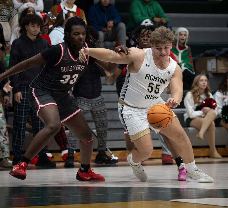 Bishop McNamara's Ian Irps controls the ball as Chicago Bulls Prep's Kel'von Gamble, left, guards in a game on Friday, Decemeber 19, 2025.