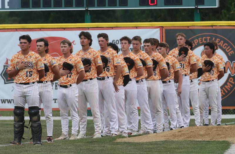 Members of the  Illinois Valley Pistol Shrimp stand for the National Anthem during First Responder Night on Tuesday, June 17, 2025 at Schweickert Stadium in Peru.