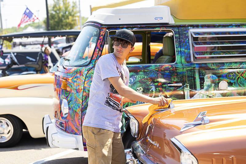 Landen Ahlmann of Waterman polishes up his ’57 Chevy Sunday, Aug. 25, 2024, in Amboy. The huge festival sees cars, trucks and bikes come in from all over the region.