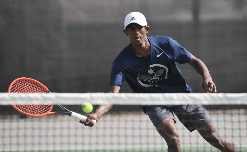 Oswego East’s Pranav Kannan plays the ball at the net during the boys state tennis tournament at Barrington High School Thursday, May 29, 2025.