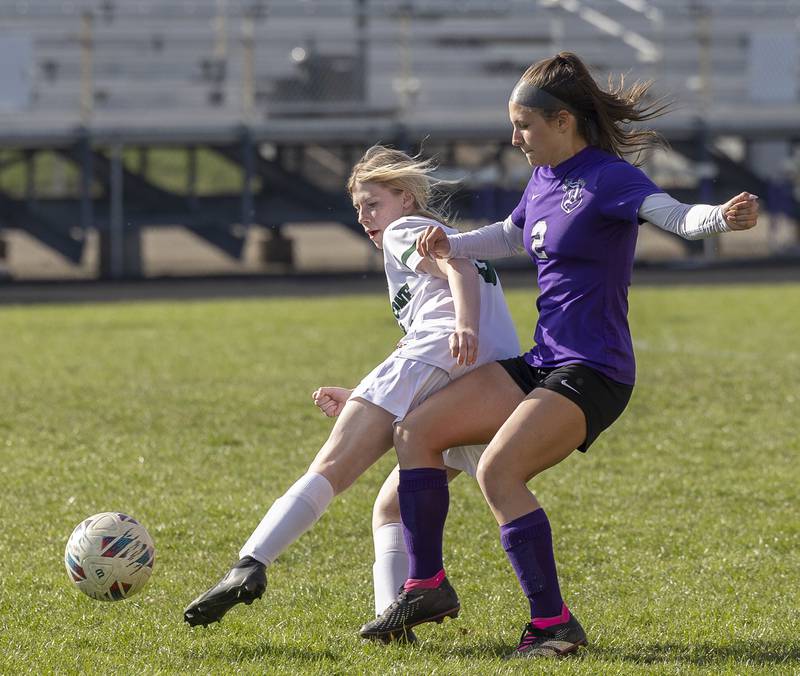 Dixon’s Meredith Foulker and North Boone’s Kayla Tootell fight for the ball Tuesday, April 15, 2025.