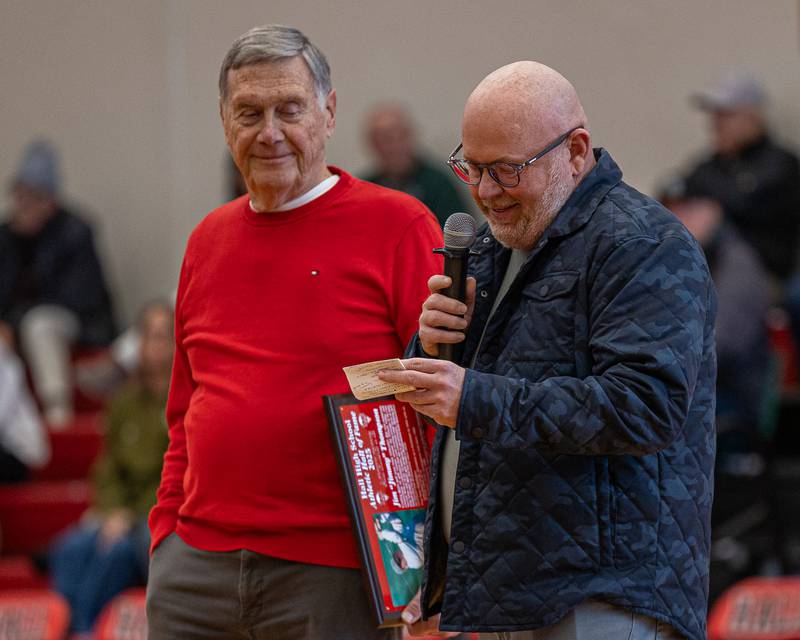 Jimmy Thompson speaks during his induction ceremony at the 2026 Hall High School Hall of Fame as former coach Gary Carruthers watches with a smile on Saturday, January 31, 2026 at Hall High School in Spring Valley.