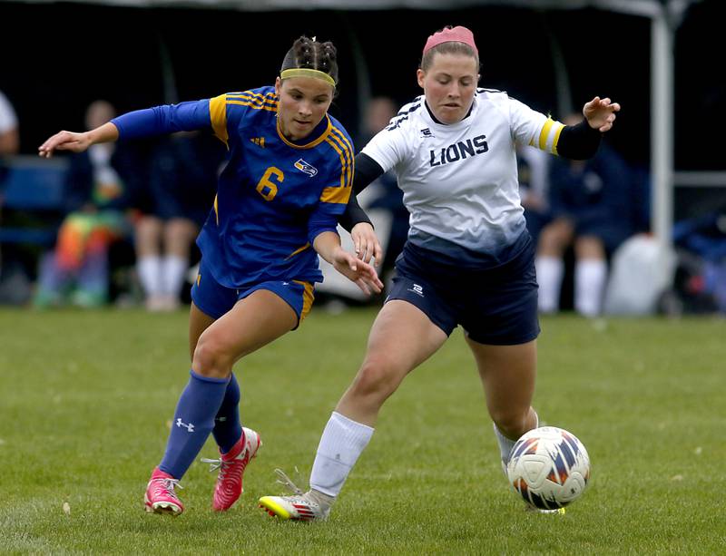Johnsburg's Liz Smith battles with Harvest Christian Academy's Hanne Giovenco to get to the ball during the Class 1A Marian Central Girls Soccer Regional Championship match on Tuesday, May 20, 2025, at Marian Central High School in Woodstock.