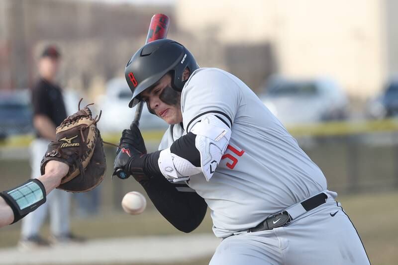Bolingbrook’s Tommy Corley gets hit by a pitch against Plainfield East on Monday, March 27, 2023.