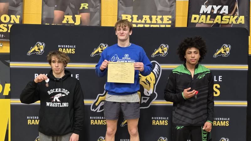 Newman's Zhyler Hansen, center, is pictured after winning the Class 1A Riverdale Regional title on Saturday, Feb. 8, 2025. Rock Falls' Adam Oquendo, right, was runner-up and Rockridge's Clayton Blumerstein was third.