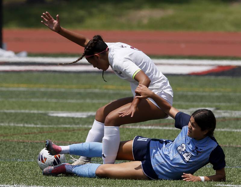 St. Ignatius College Prep's Sofia Knoepp and Nazareth Academy's Daniella Berruti get tangled up playing the ball during a IHSA Class 2A State Girls Soccer semifinal match on Friday, June 6, 2025, at North Central College in Naperville.