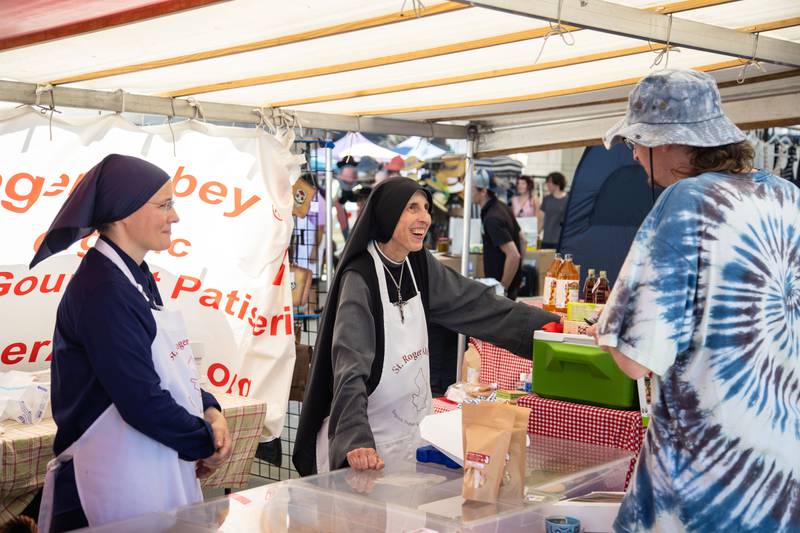 The Nuns of St. Roger Abbey sell baked goods during Make Music Wheaton and the Wheaton French Market in The Wheaton French Market Plaza on Saturday, June 21, 2025.