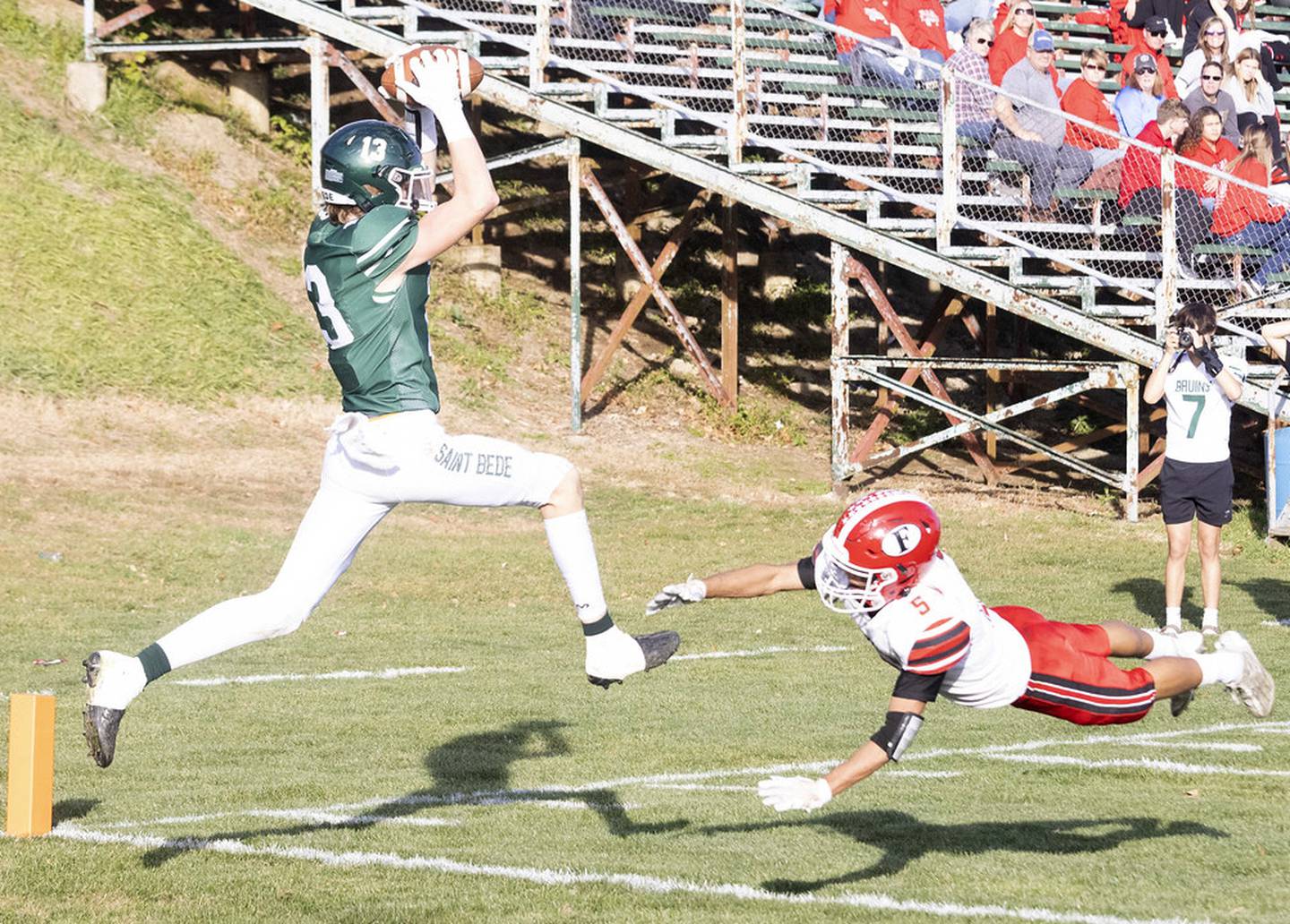 St. Bede's Ben Wallace (13) makes a catch for a touchdown over Morrison's McKreon Crase (5) during the Class 1A first round playoff game on Saturday, Oct. 29, 2022 at the Academy in Peru.
