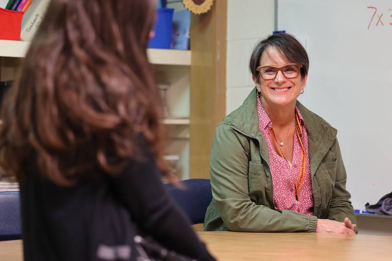 Mary Lynn Buckner, (right) longtime special education teacher at Littlejohn Elementary School in DeKalb, listens as a colleague talks Wednesday, Feb. 23, 2023, about about why Buckner is such a valuable asset to students and faculty at the school.