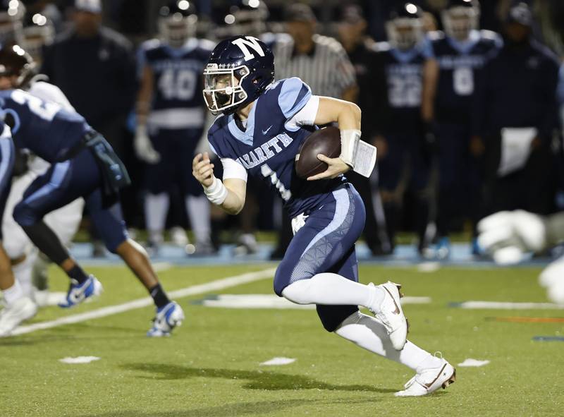 Nazareth's Logan Malachuk (1) runs during the varsity football game between Joliet Catholic and Nazareth in September in La Grange Park.
