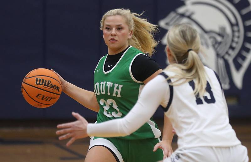 Crystal Lake South's Estrada Khloe passes the ball as she is guarded by Cary-Grove's Malaina Kurth during a Fox Valley Conference girls basketball game on Tuesday, Dec. 2, 2025, at Cary-Grove High School in Cary.