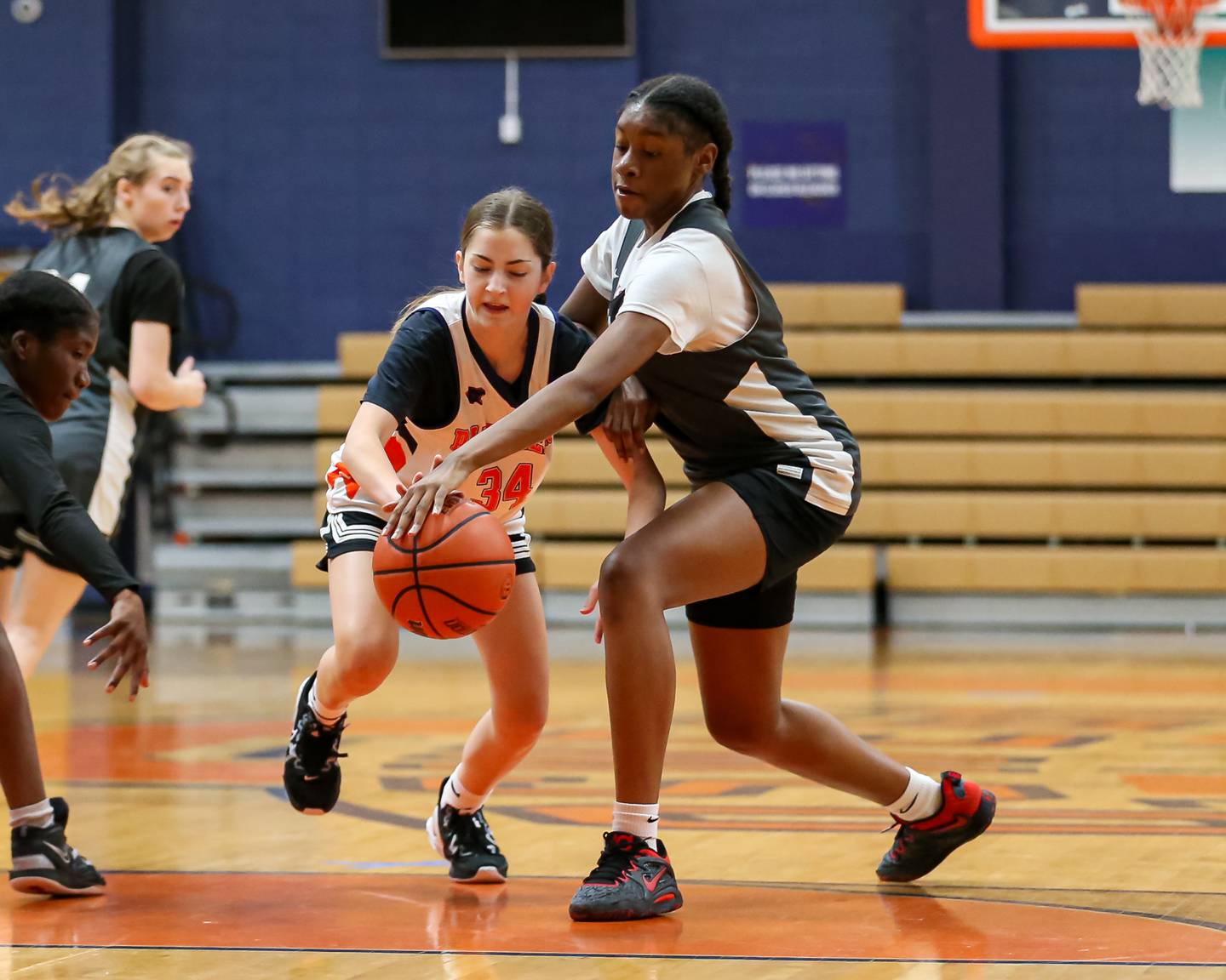 Dekalb's Brytasia Long (R) fights for possession of the ball at the Oswego Girls Basketball Shootout . June 30, 2023.